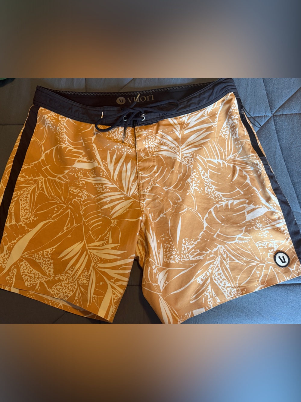 Vuori Board Swim Shorts (Black with light brown floral patterns)